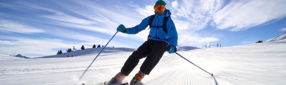 Professional,Skier,Skiing,On,Slopes,In,The,Swiss,Alps,Towards