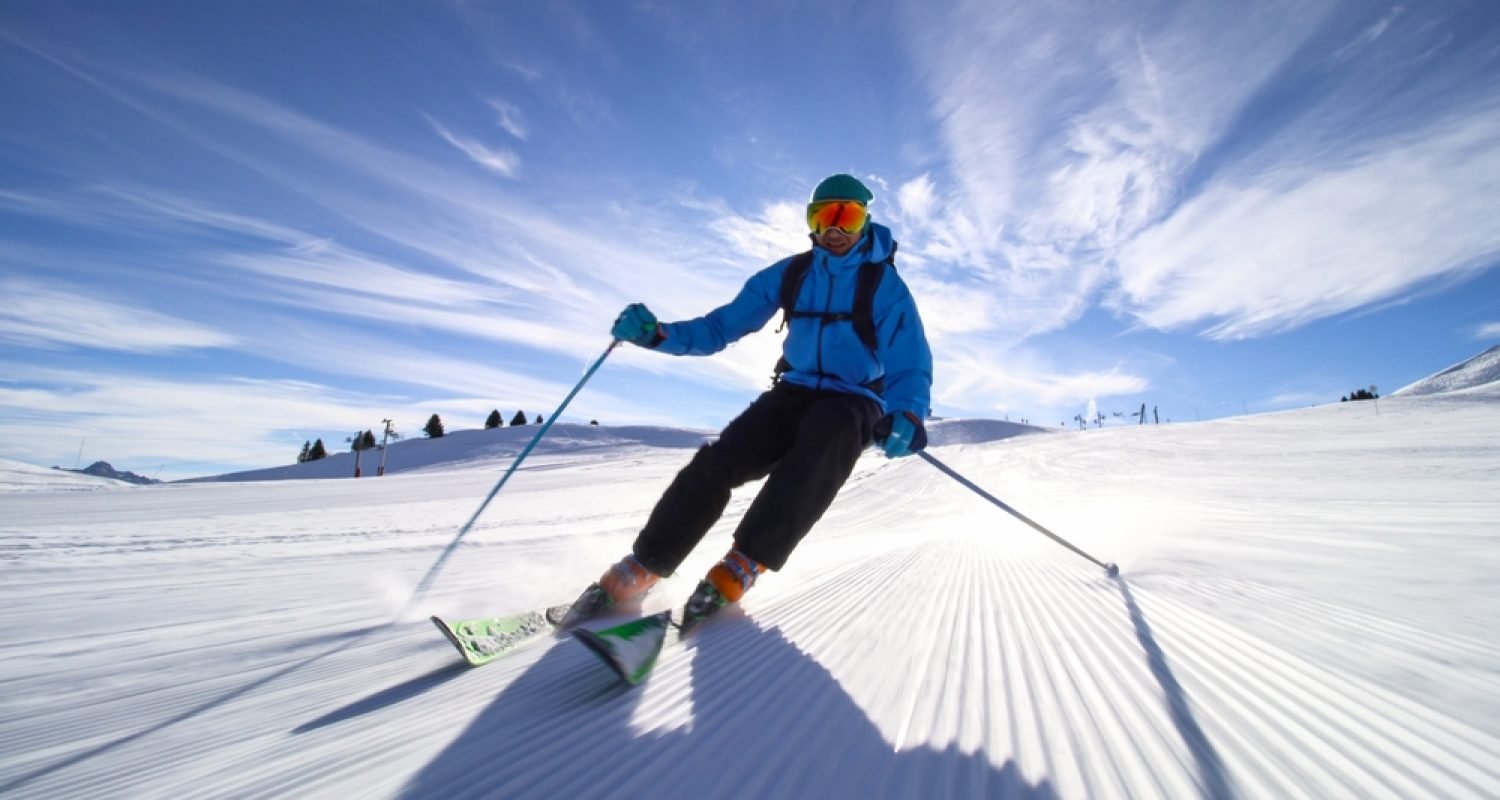 Professional,Skier,Skiing,On,Slopes,In,The,Swiss,Alps,Towards